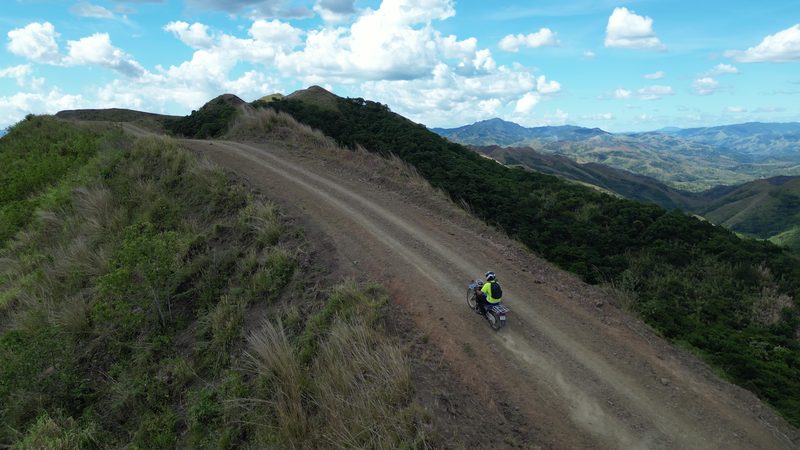Drone shot of rider on ridgeline