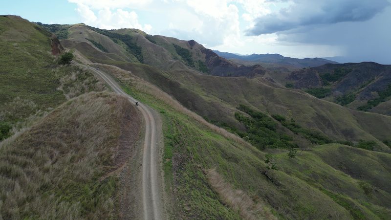 Drone view of ridge road with riders