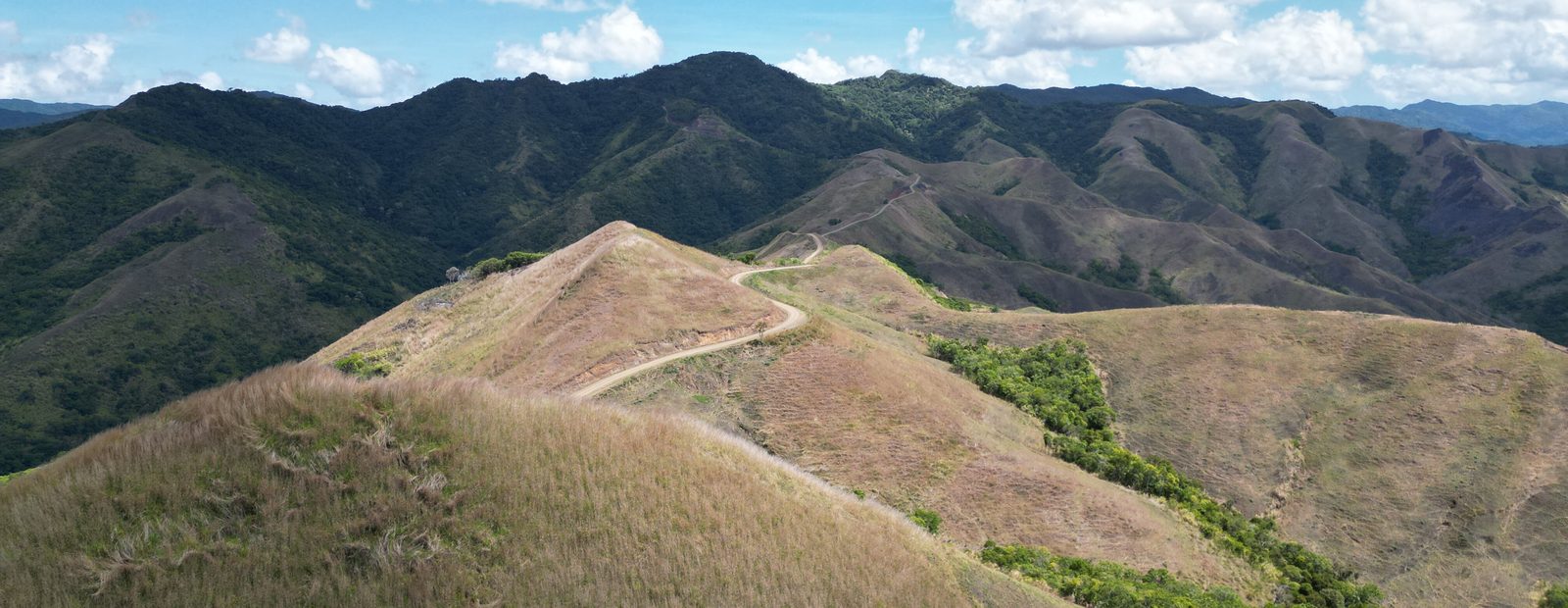 Winding ridgeline road through highlands